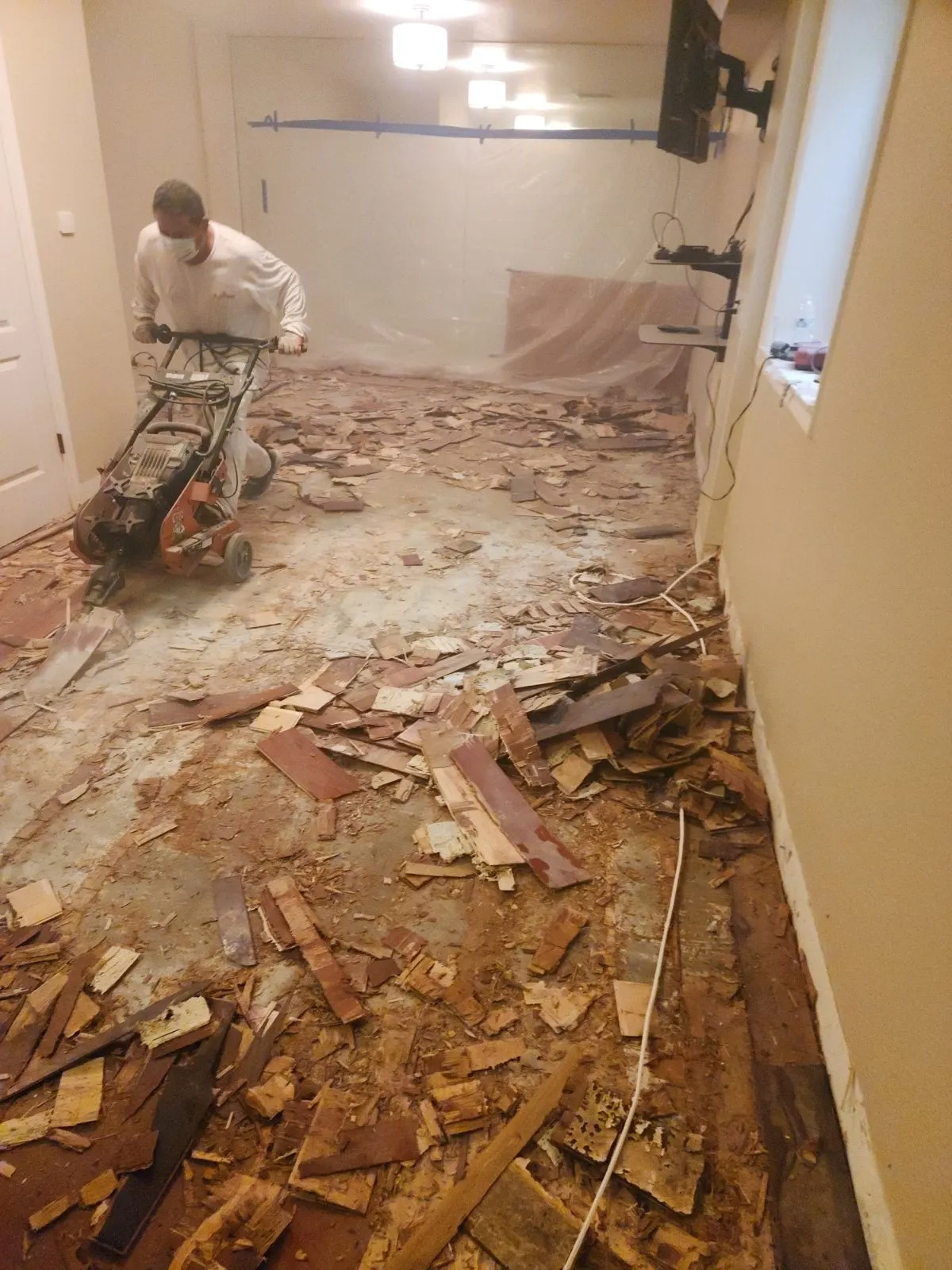 Crew removing old wood flooring