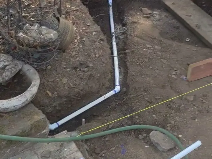 Drain pipe laid in a trench before paving